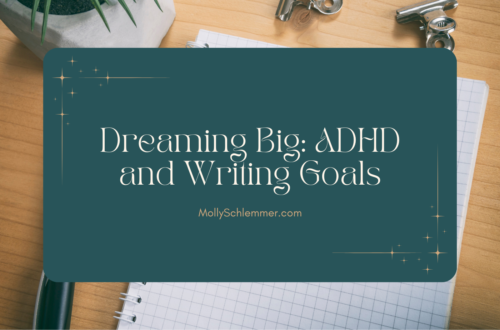 A turquoise rectangle sits in the center of an image of a desktop, with the post title "Dreaming Big: ADHD and Writing Goals" in the center of the rectangle.